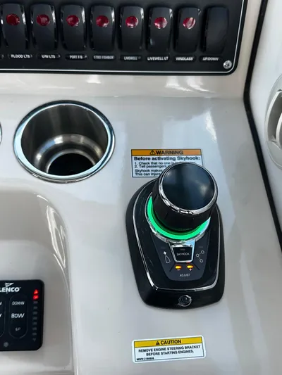  Yacht Photos Pics Control panel of 2022 Boston Whaler 345 Conquest boat with joystick and switches.