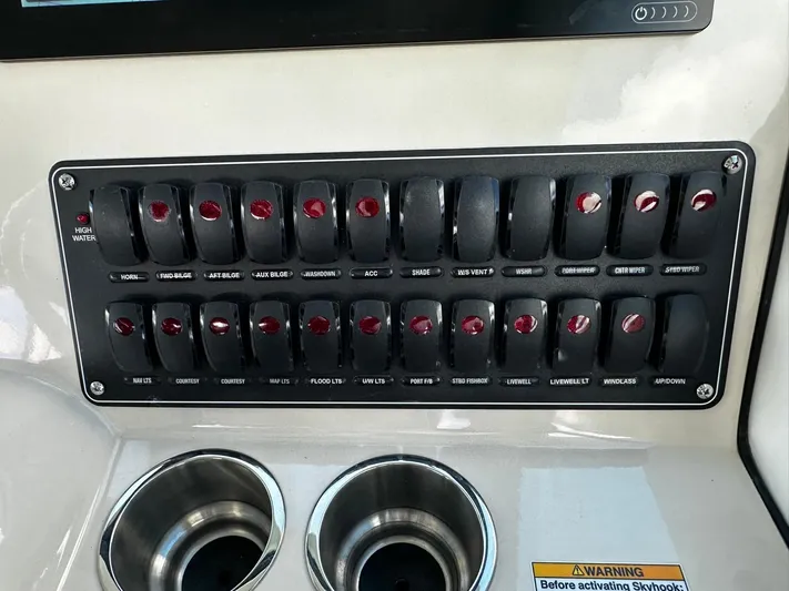  Yacht Photos Pics Control panel of a 2022 Boston Whaler 345 Conquest boat with labeled switches.