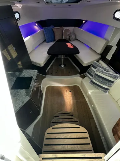  Yacht Photos Pics 2022 Boston Whaler 345 Conquest cabin interior with modern seating and ambient lighting.