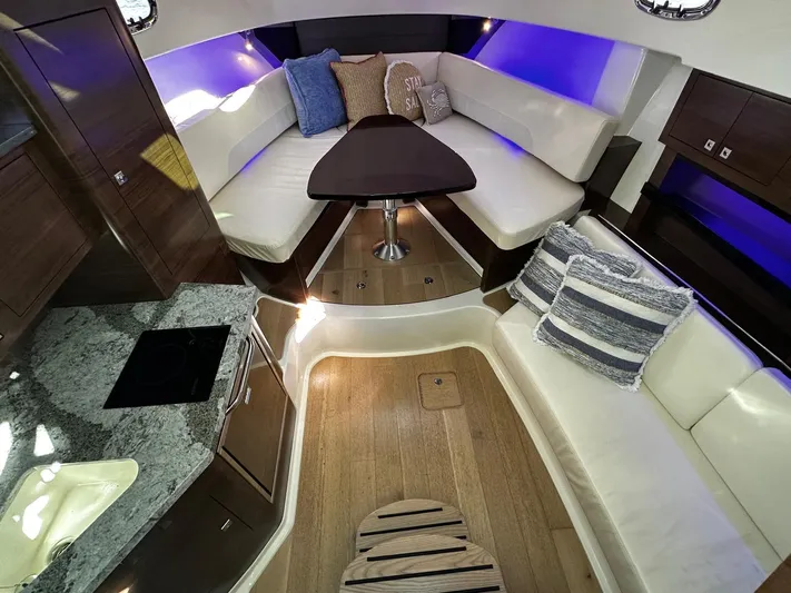  Yacht Photos Pics Luxurious interior of 2022 Boston Whaler 345 Conquest with elegant seating and ambient lighting.