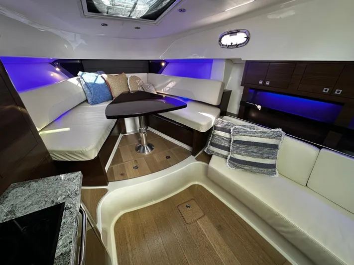  Yacht Photos Pics Luxurious interior of 2022 Boston Whaler 345 Conquest with plush seating and ambient lighting.