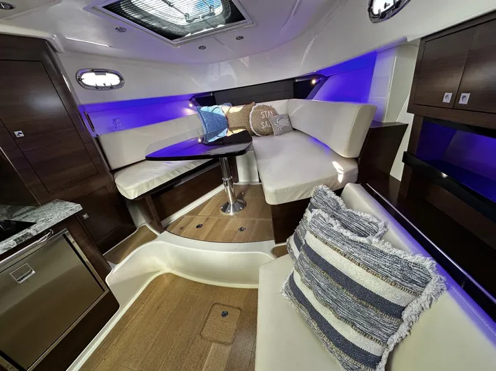  Yacht Photos Pics Luxurious interior of 2022 Boston Whaler 345 Conquest with plush seating and ambient lighting.