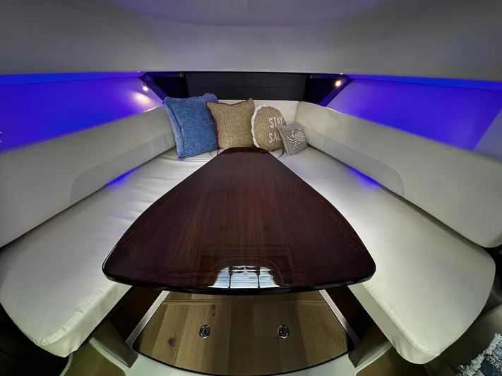  Yacht Photos Pics Luxurious interior of 2022 Boston Whaler 345 Conquest with ambient lighting and plush seating.