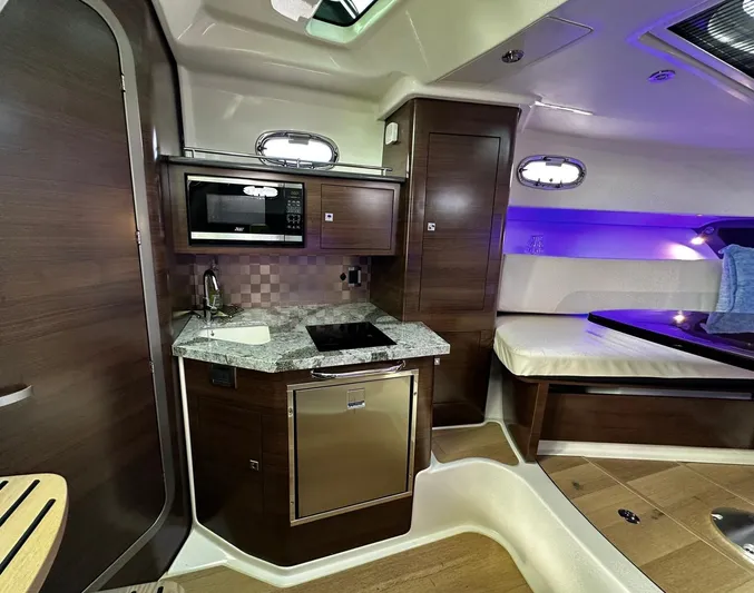  Yacht Photos Pics Luxurious interior of 2022 Boston Whaler 345 Conquest boat with modern kitchen amenities.