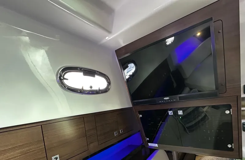  Yacht Photos Pics Interior of 2022 Boston Whaler 345 Conquest with TV and porthole window.