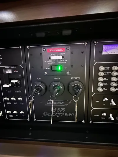  Yacht Photos Pics Control panel of 2022 Boston Whaler 345 Conquest boat with switches and indicators.