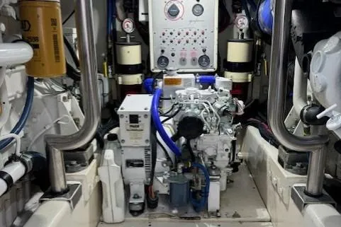 Enticer Yacht Photos Pics Engine room of 1998 Gamefisherman 34 Express boat with control panel and machinery.