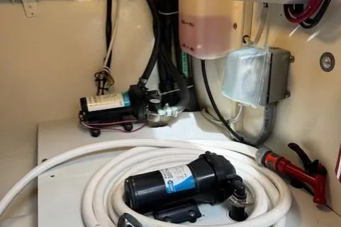 Enticer Yacht Photos Pics 1998 Gamefisherman 34 Express engine room with pumps and wiring.