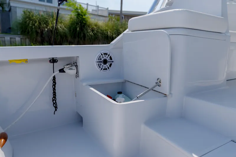 Enticer Yacht Photos Pics 1998 Gamefisherman Enticer boat interior with storage compartment and speaker.