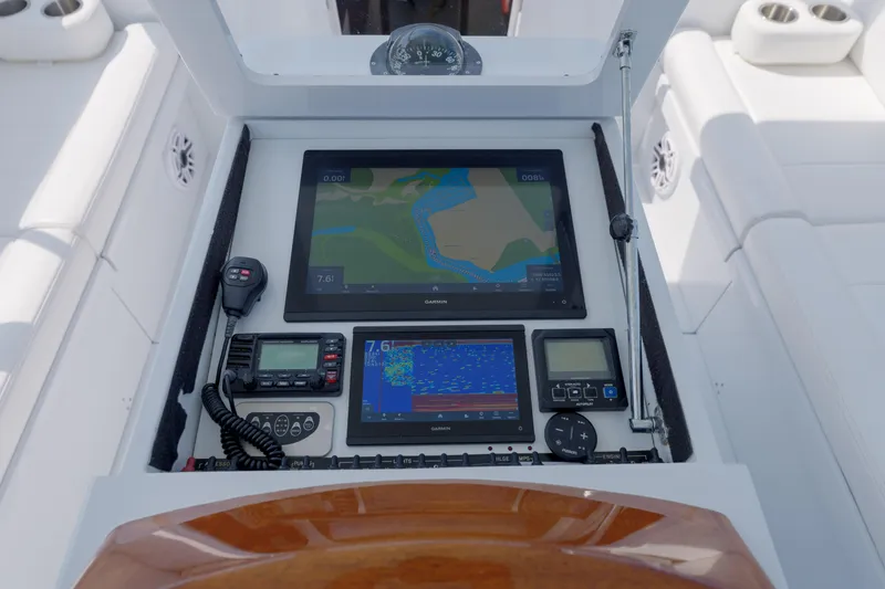 Enticer Yacht Photos Pics Control panel of a 1998 Gamefisherman Enticer boat with navigation and communication equipment.