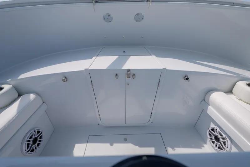 Enticer Yacht Photos Pics 1998 Gamefisherman Enticer boat interior with white seating and storage compartments.