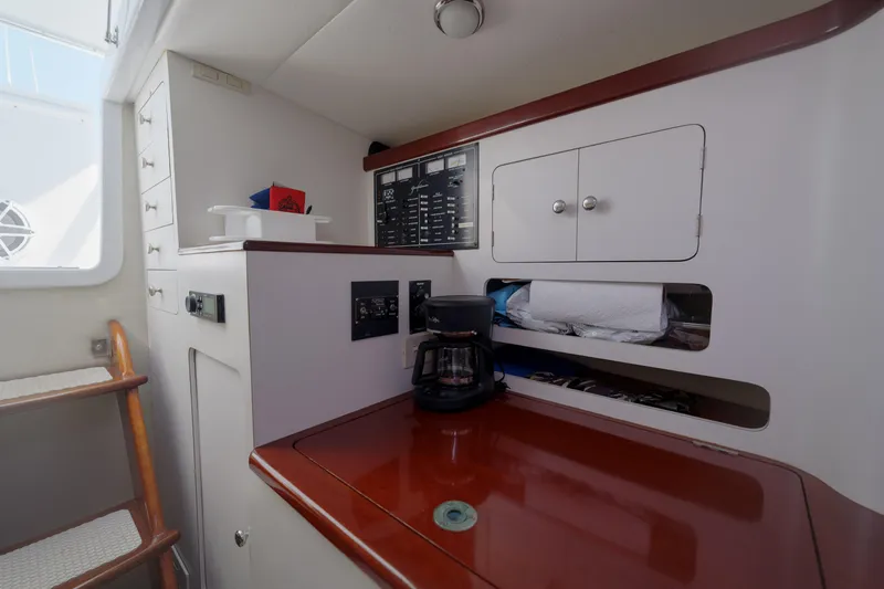 Enticer Yacht Photos Pics Interior of 1998 Gamefisherman Enticer boat with wooden counter and coffee maker.