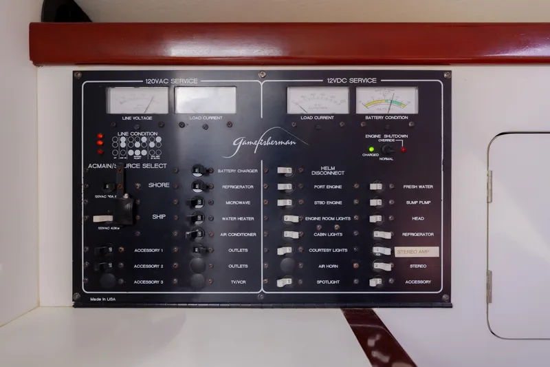 Enticer Yacht Photos Pics Electrical control panel on a 1998 Gamefisherman Enticer boat, featuring various switches and indicators.