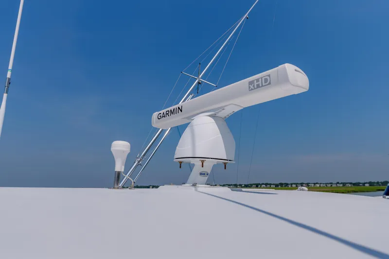 Enticer Yacht Photos Pics Radar equipment on 1998 Gamefisherman Enticer boat under clear blue sky.