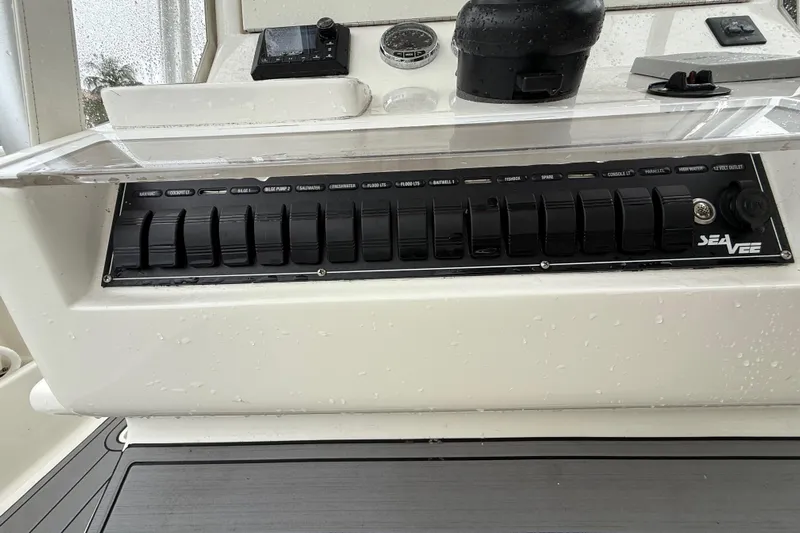  Yacht Photos Pics Control panel of a 2020 SeaVee 290B boat with switches and gauges.