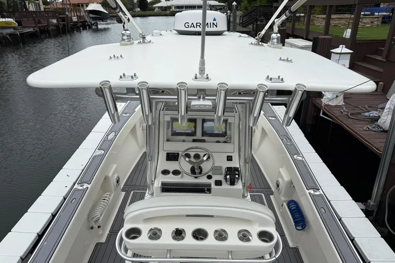  Yacht Photos Pics 2020 SeaVee 290B boat with advanced Garmin navigation system, docked in a serene marina.