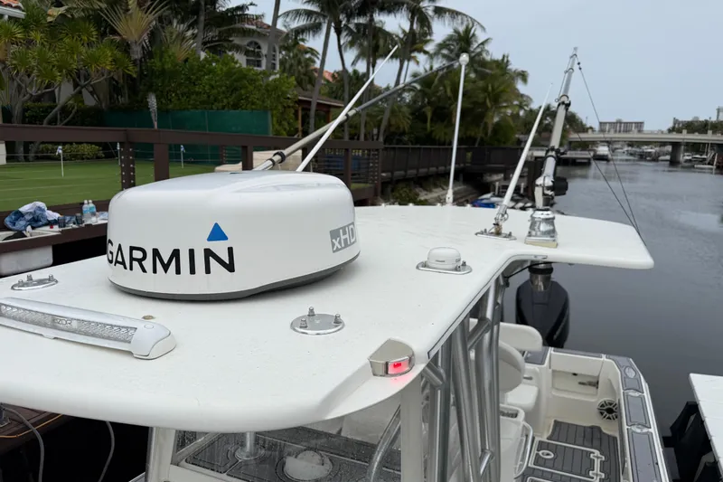  Yacht Photos Pics 2020 SeaVee 290B boat with Garmin xHD radar, docked near palm trees and waterway.