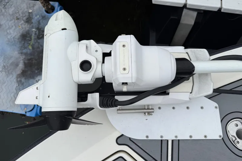  Yacht Photos Pics 2020 SeaVee 290B boat with mounted trolling motor, docked.