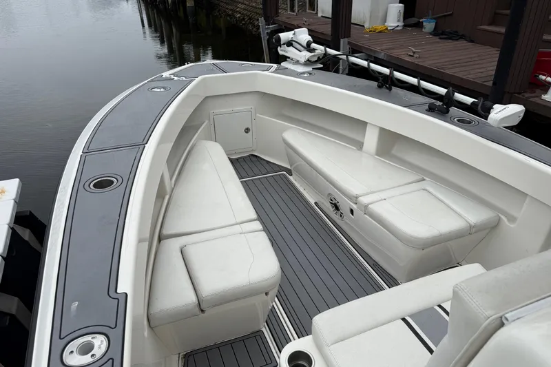  Yacht Photos Pics 2020 SeaVee 290B boat interior with cushioned seating and sleek design.