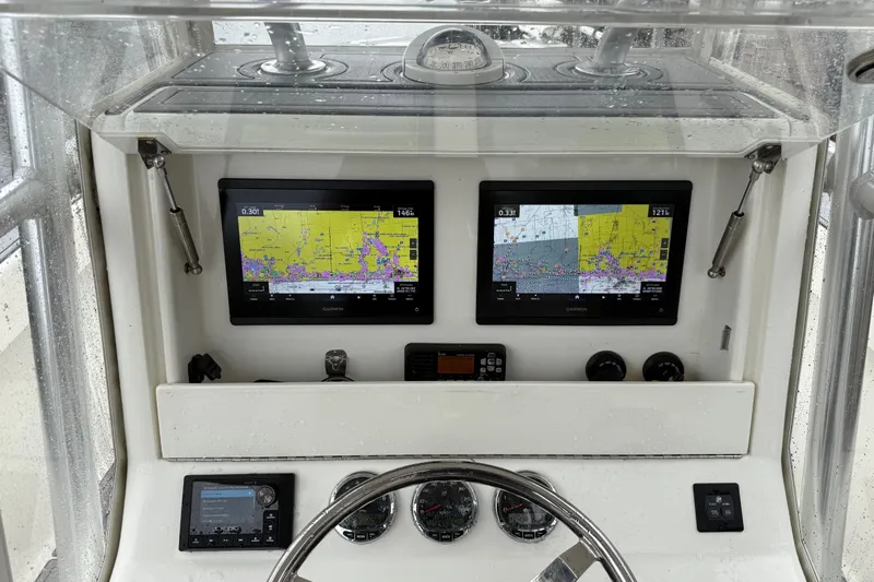  Yacht Photos Pics 2020 SeaVee 290B boat dashboard with dual Garmin navigation screens and controls.
