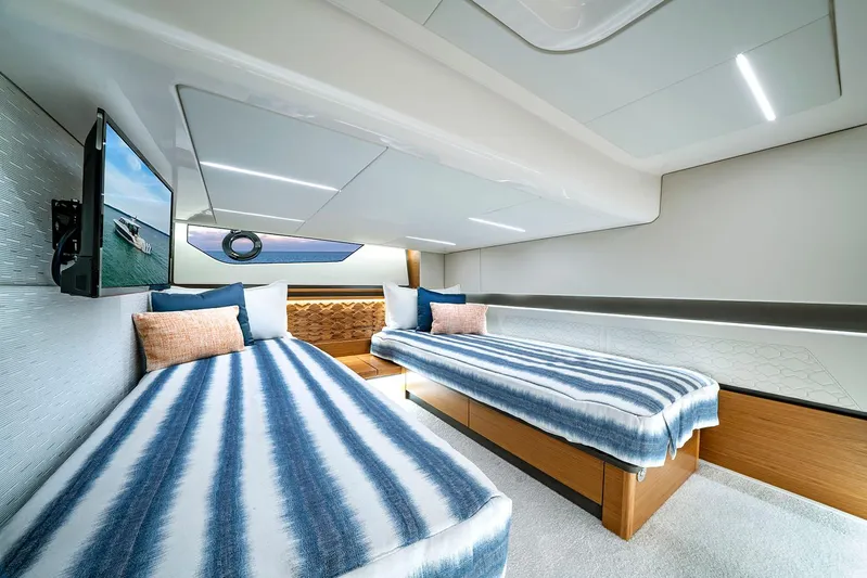  Yacht Photos Pics Manufacturer Provided Image: 2025 Tiara Yachts 48 LE interior cabin with twin beds and modern design.