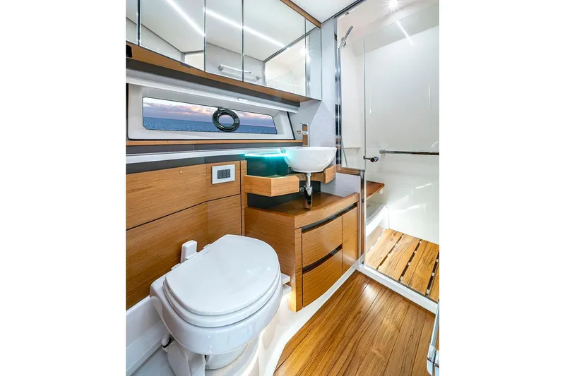  Yacht Photos Pics Manufacturer Provided Image: Luxurious bathroom in 2025 Tiara Yachts 48 LE, featuring modern fixtures and wood accents.