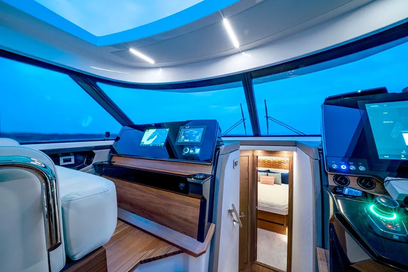  Yacht Photos Pics Manufacturer Provided Image: Luxurious interior of 2025 Tiara Yachts 48 LE, featuring modern navigation systems and cozy cabin.