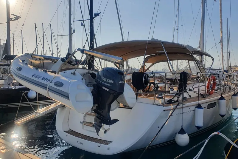  Yacht Photos Pics 2013 Jeanneau 57 yacht docked with Yamaha motor and inflatable boat.