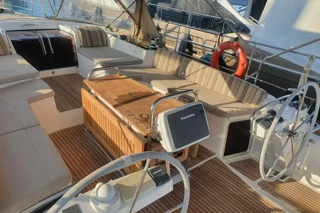  Yacht Photos Pics Luxurious 2013 Jeanneau 57 yacht cockpit with teak flooring and comfortable seating.