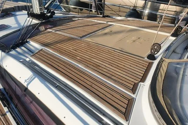  Yacht Photos Pics Deck of 2013 Jeanneau 57 sailboat with teak wood finish and rigging details.