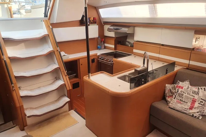  Yacht Photos Pics Interior of 2013 Jeanneau 57 yacht featuring modern kitchen and cozy seating area.