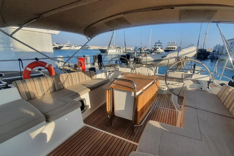  Yacht Photos Pics Luxurious 2013 Jeanneau 57 yacht interior with spacious seating and elegant wood finish.