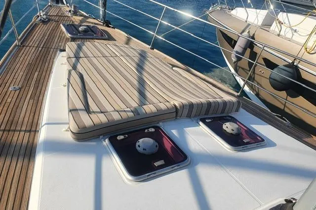  Yacht Photos Pics 2013 Jeanneau 57 yacht deck with sunbathing area and ocean view.