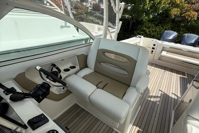  Yacht Photos Pics 2016 Sailfish 325 DC boat interior with helm seat and steering wheel.