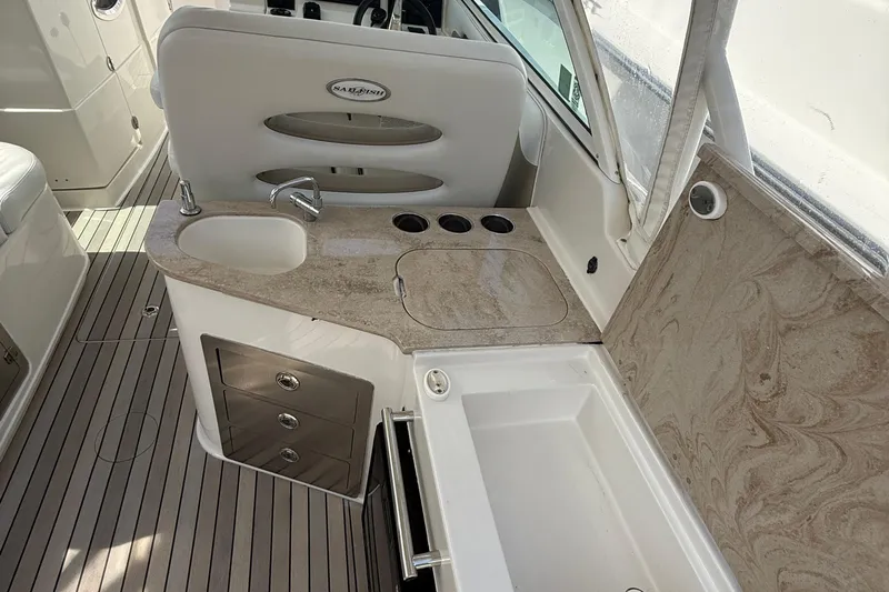 Yacht Photos Pics Interior of 2016 Sailfish 325 DC boat with sink, countertop, and storage drawers.