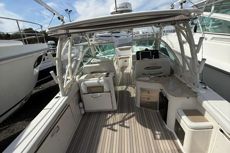  Yacht Photos Pics 2016 Sailfish 325 DC boat interior with seating, storage, and navigation equipment.