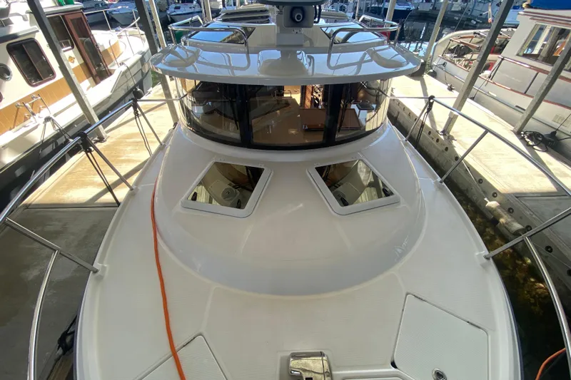  Yacht Photos Pics 2019 Ranger Tugs R-29 S boat docked, showcasing sleek design and spacious deck.
