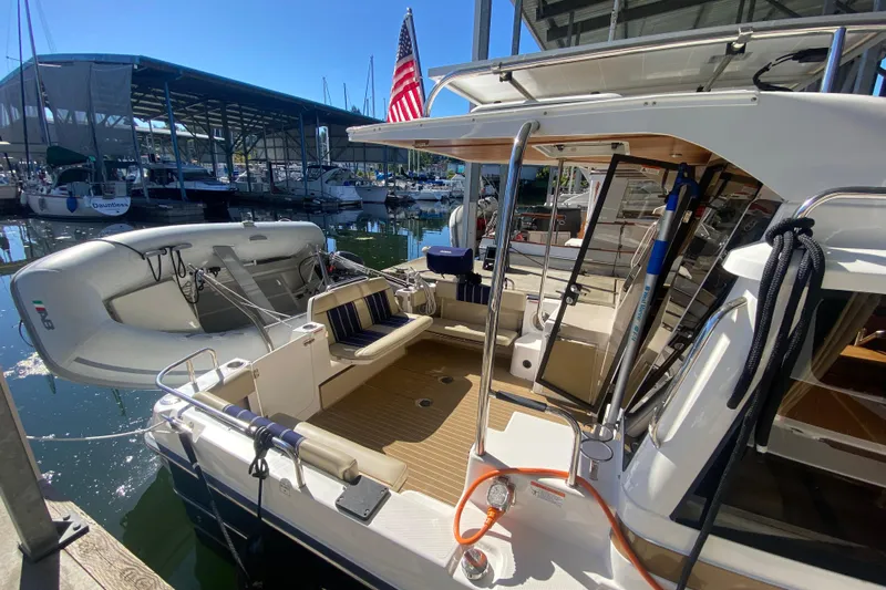  Yacht Photos Pics 2019 Ranger Tugs R-29 S docked, featuring spacious deck and attached dinghy.