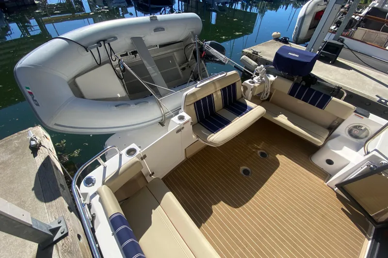  Yacht Photos Pics 2019 Ranger Tugs R-29 S boat interior with seating and inflatable dinghy.