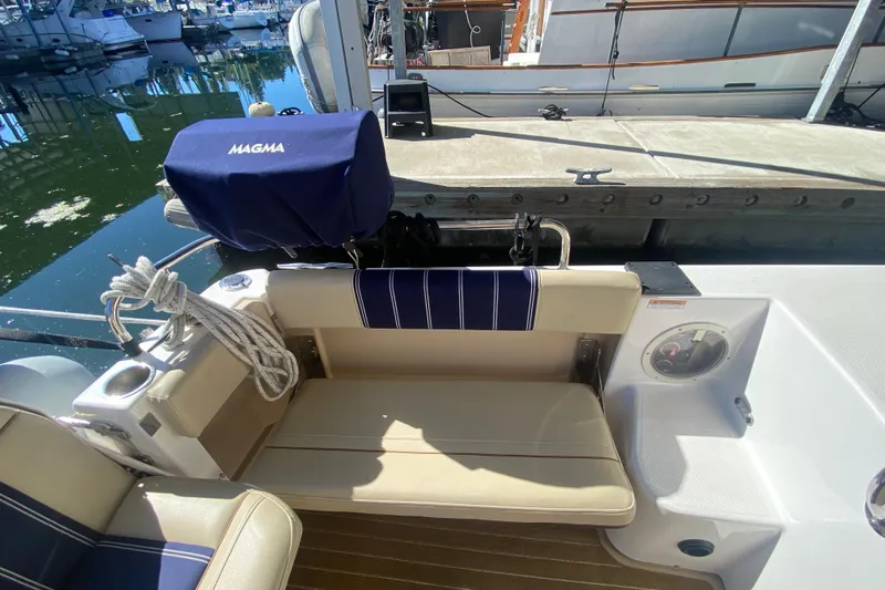  Yacht Photos Pics 2019 Ranger Tugs R-29 S boat interior with seating and dock view.