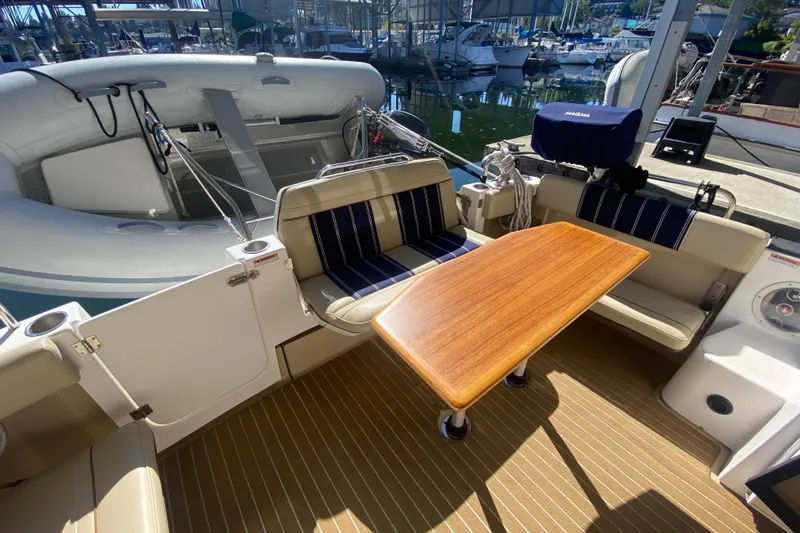  Yacht Photos Pics 2019 Ranger Tugs R-29 S boat interior with seating and wooden table.