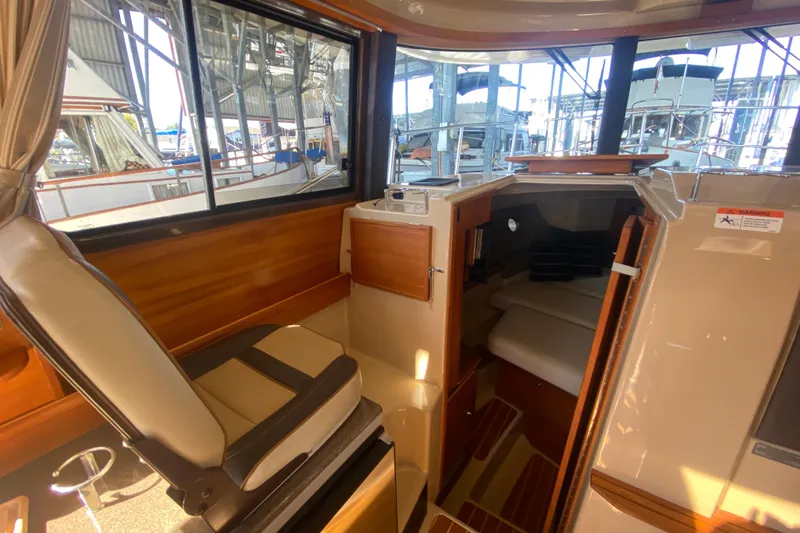  Yacht Photos Pics 2019 Ranger Tugs R-29 S interior cabin with seating and sleeping area.