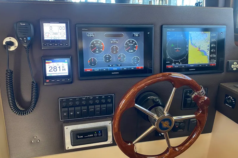  Yacht Photos Pics 2019 Ranger Tugs R-29 S helm with Garmin displays and wooden steering wheel.