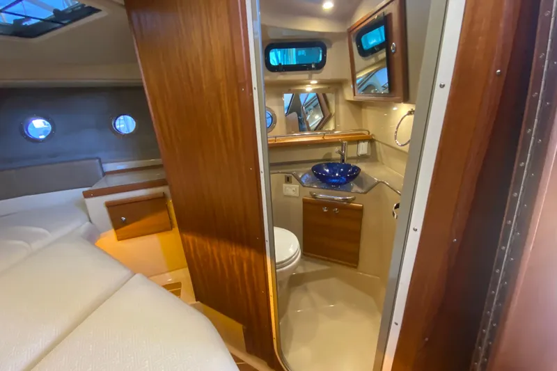  Yacht Photos Pics 2019 Ranger Tugs R-29 S interior with cozy cabin and modern bathroom.