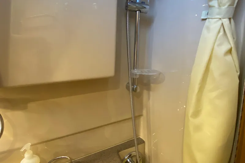  Yacht Photos Pics 2019 Ranger Tugs R-29 S bathroom with showerhead and curtain.