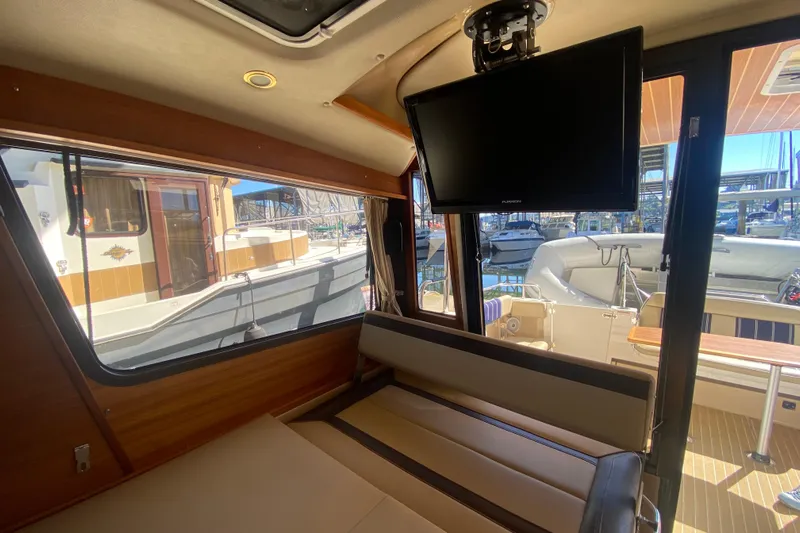  Yacht Photos Pics Interior of 2019 Ranger Tugs R-29 S with TV and marina view.