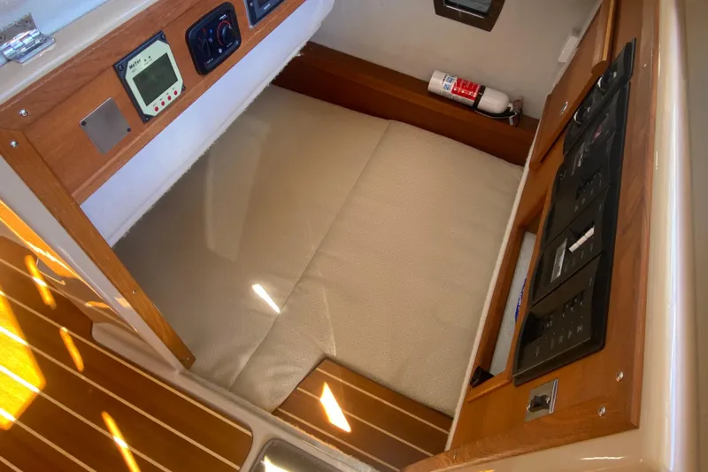  Yacht Photos Pics 2019 Ranger Tugs R-29 S interior cabin with control panels and fire extinguisher.