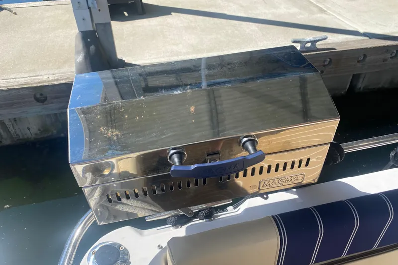  Yacht Photos Pics Stainless steel Magma grill on 2019 Ranger Tugs R-29 S boat docked by water.