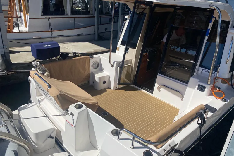  Yacht Photos Pics 2019 Ranger Tugs R-29 S boat with open deck and seating area.