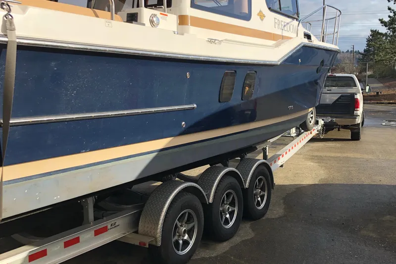  Yacht Photos Pics 2019 Ranger Tugs R-29 S boat on trailer, hitched to a truck.